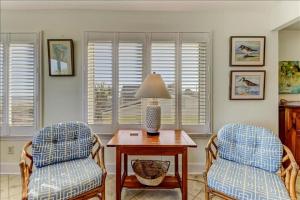 Spacious living area, windows across entire length of home.
