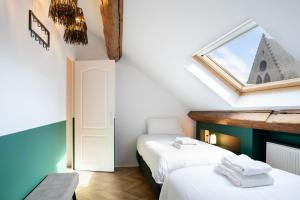 Appartements Ma Suite - Maison Tillot : photos des chambres