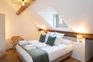 Appartements Ma Suite - Maison Tillot : photos des chambres