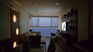 A melhor vista de Santos para 5 pessoas pé na areia