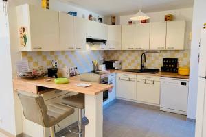 Appartements Le Petit Blanc - Vue sur le Square des Lions : photos des chambres