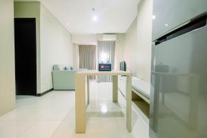 Spacious and Comfy 2BR Nifarro Park Apartment By Travelio