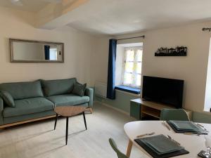 Appartements Jolie Vue Cite, aux pieds des remparts : photos des chambres