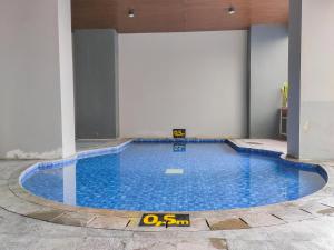 Compact and Cozy Tamansari Mahogany Studio Apartment By Travelio