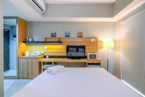 Stylish and Cozy Studio No Kitchen Apartment Mustika Golf Residence By Travelio