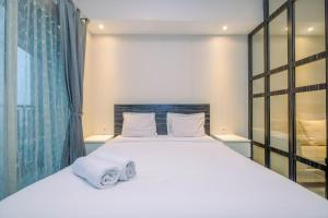 Warm and Cozy Studio at The Oasis Cikarang Apartment By Travelio