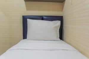 Minimalist 2BR Green Pramuka City Apartment near Shopping Mall By Travelio