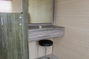 Minimalist 2BR Green Pramuka City Apartment near Shopping Mall By Travelio