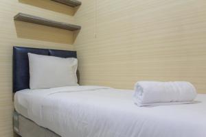 Minimalist 2BR Green Pramuka City Apartment near Shopping Mall By Travelio