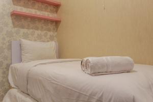 Minimalist and Homey 2BR Aparment at Green Pramuka near Mall By Travelio