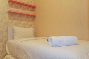 Minimalist and Homey 2BR Aparment at Green Pramuka near Mall By Travelio