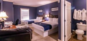 Queen Room with Two Queen Beds room in Depot Inn & Suites
