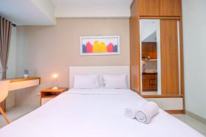 Homey and Relaxing Studio @ Grand Dhika City Apartment By Travelio
