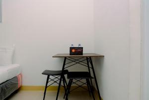 Cozy Living Studio Apartment at Bassura City By Travelio