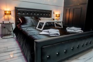 Appart'hotels Appart Hotel GLAM88 Suites avec SPA et Sauna Privatif : photos des chambres