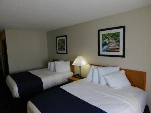 Queen Room with Two Queen Beds room in Northwoods Best Inn