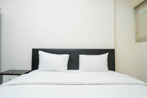 Cozy and Minimalist 2BR at Marbella Kemang Apartment By Travelio