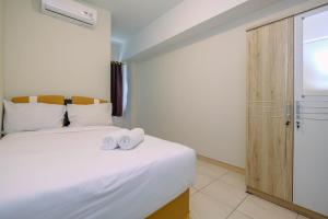 Homey 2BR Apartment at Springlake Summarecon Bekasi By Travelio