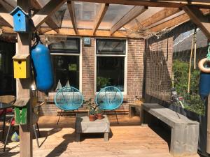 BelleMare Bungalow Lauwersmeer mit überdachte Veranda und eingezäuntem Garten
