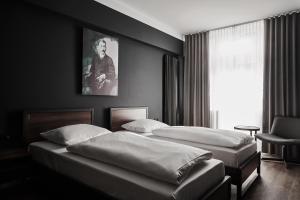 Bed in Mixed Twin Room with Shared Bathroom room in GRONERS Leipzig