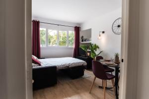 Appartements Les Sorbiers - CENTRE VILLE - Spacieux & Climatisation : photos des chambres