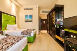 Deluxe Double or Twin Room with City View room in Bahi Ajman Palace Hotel