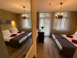 Triple Room with Balcony room in Alp Hotel
