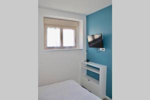 Appartements La petite maison 3 : photos des chambres