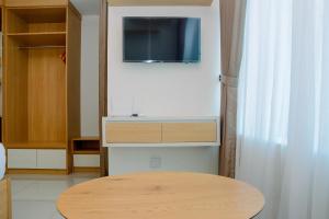 Simple Studio Apartment at Grand Kamala Lagoon By Travelio