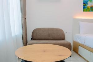 Simple Studio Apartment at Grand Kamala Lagoon By Travelio