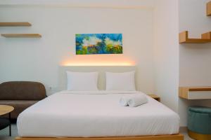 Simple Studio Apartment at Grand Kamala Lagoon By Travelio