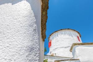 Old Windmill in Triandaros village Tinos Greece