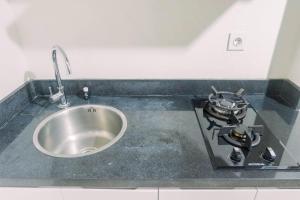 Lavish 2BR Apartment at Grand Sungkono Lagoon By Travelio