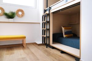 Bed in 4-Bed Mixed Dormitory Room room in TAKE SURF Hostel Conil