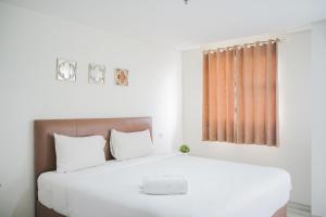 Minimalist Studio Bintaro Icon Apartment near British School By Travelio