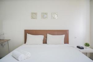Minimalist Studio Bintaro Icon Apartment near British School By Travelio
