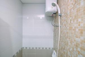 Homey and Comfortable 1BR Apartment at Royal Olive Residence By Travelio