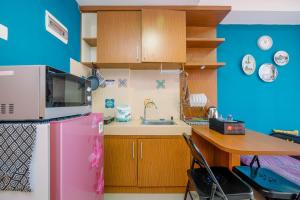 Homey and Comfortable 1BR Apartment at Royal Olive Residence By Travelio