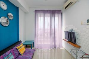 Homey and Comfortable 1BR Apartment at Royal Olive Residence By Travelio