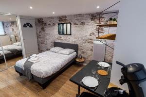 Appartements VilleneuveCityStay Moderne : photos des chambres