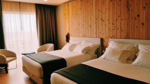 Family Room with Garden View room in Pedras do Mar Resort & Spa