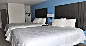 Queen Room with Two Queen Beds with Sofa Bed room in SureStay Plus Hotel by Best Western Niagara Falls East