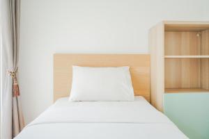 Spacious and Elegant 2BR M-Town Serpong Apartment By Travelio