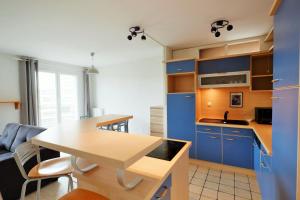 Appartements 70 m2 avec Balcons et Parking : photos des chambres