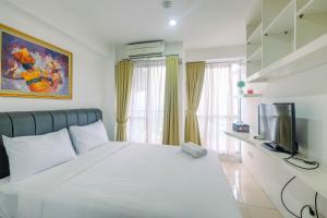 Modern Studio at Tifolia Apartment By Travelio