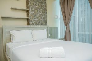 Chic and Spacious 2BR Apartment at Brooklyn Alam Sutera By Travelio