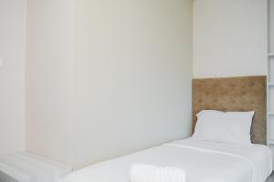 Chic and Spacious 2BR Apartment at Brooklyn Alam Sutera By Travelio