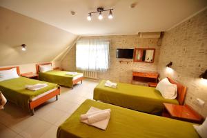 Economy Quadruple Room with Shared Bathroom room in Hotel Ruslan