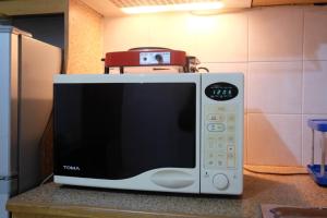 New Furnished 1BR Rajawali Apartment By Travelio