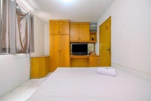 New Furnished 1BR Rajawali Apartment By Travelio